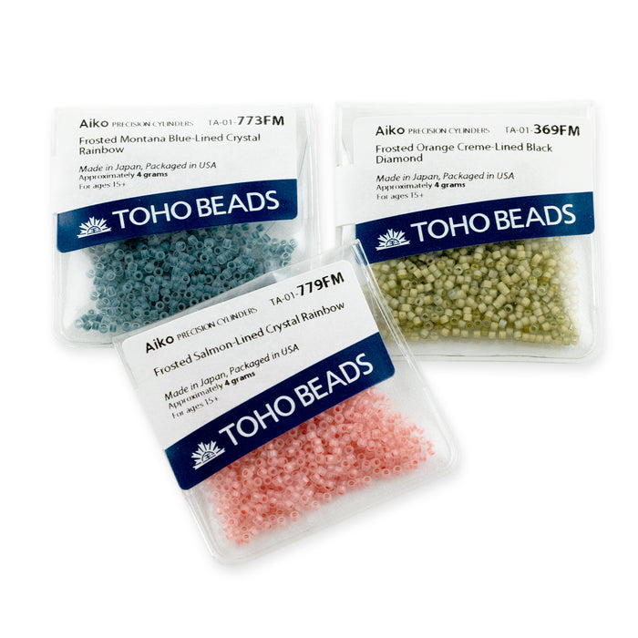 Toho Aiko Seed Beads, 11/0 #1835 'White-Lined Aqua Rainbow' (4 Grams)